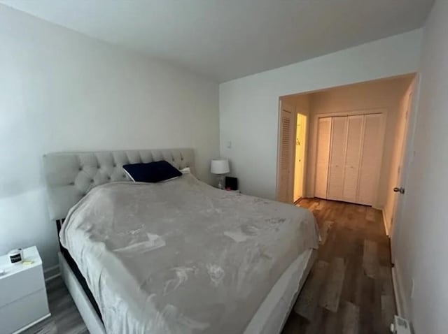 bedroom featuring dark hardwood / wood-style flooring