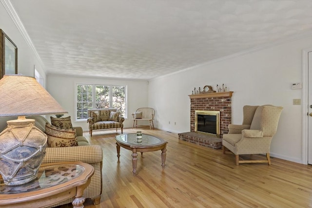 22 Mikayla Ann Dr, Rehoboth, MA 02769 - living room featuring light wood finished floors, a fireplace, crown molding, and baseboards