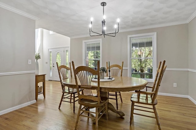 22 Mikayla Ann Dr, Rehoboth, MA 02769 - dining room featuring light wood-type flooring, a chandelier, baseboards, and crown molding