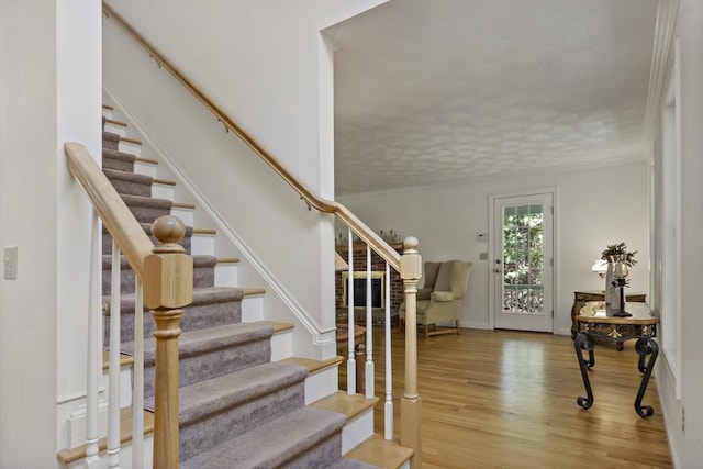 22 Mikayla Ann Dr, Rehoboth, MA 02769 - staircase with wood finished floors and crown molding