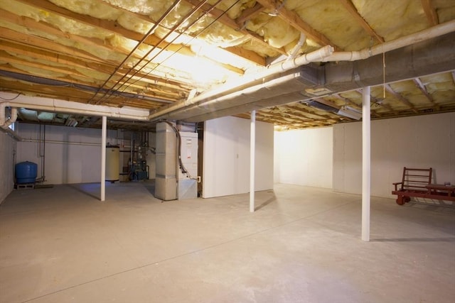 22 Mikayla Ann Dr, Rehoboth, MA 02769 - unfinished below grade area featuring water heater, a water pressure tank, and heating unit