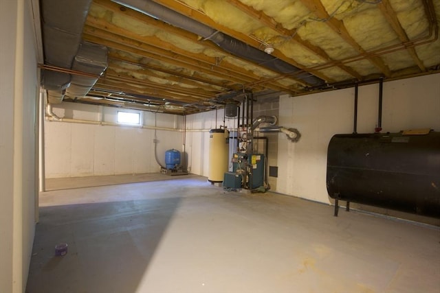 22 Mikayla Ann Dr, Rehoboth, MA 02769 - below grade area with oil tank, water heater, a water pressure tank, and a heating unit