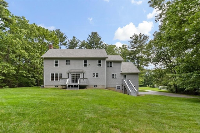 22 Mikayla Ann Dr, Rehoboth, MA 02769 - rear view of property with a chimney, a wooden deck, a lawn, and view of wooded area