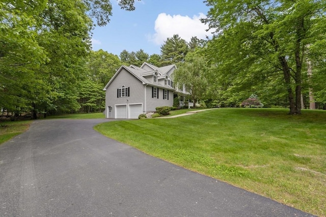 22 Mikayla Ann Dr, Rehoboth, MA 02769 - view of front of house with an attached garage, a front yard, and asphalt driveway