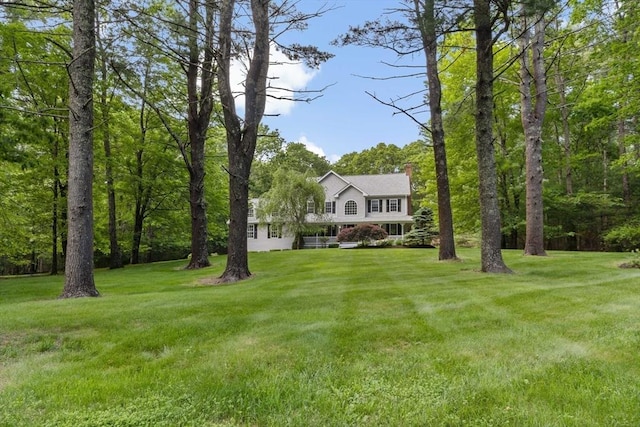 22 Mikayla Ann Dr, Rehoboth, MA 02769 - view of front of house with a chimney and a front lawn