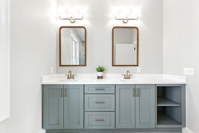 full bathroom featuring double vanity and a sink