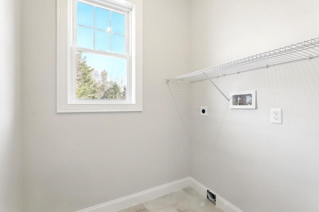 laundry room featuring washer hookup, laundry area, baseboards, and hookup for an electric dryer