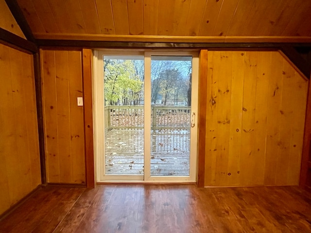 doorway to outside with hardwood / wood-style flooring and wooden ceiling