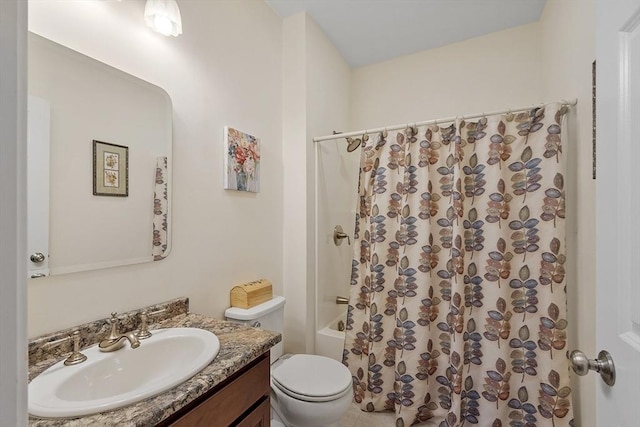 bathroom with vanity, toilet, and shower / bath combo with shower curtain