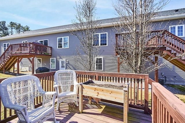 wooden terrace featuring stairs