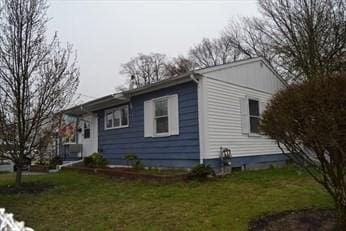 view of home's exterior featuring a yard