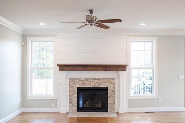 unfurnished living room with a wealth of natural light and light wood-type flooring