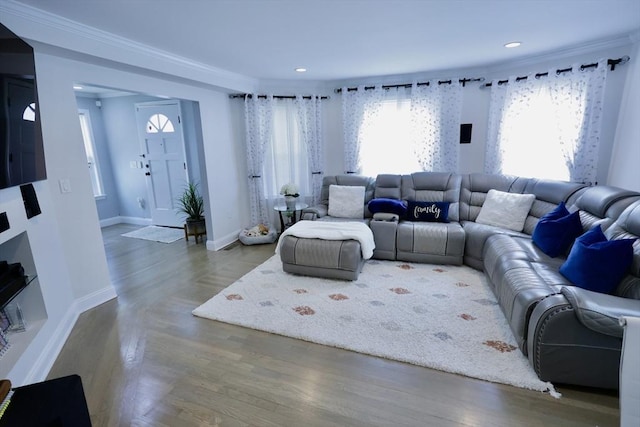 21 Florence Ave, Lowell, MA 01851 - living room with healthy amount of natural light, wood finished floors, baseboards, ornamental molding, and recessed lighting