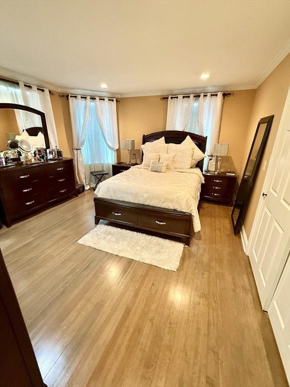 21 Florence Ave, Lowell, MA 01851 - bedroom with wood finished floors, crown molding, and recessed lighting