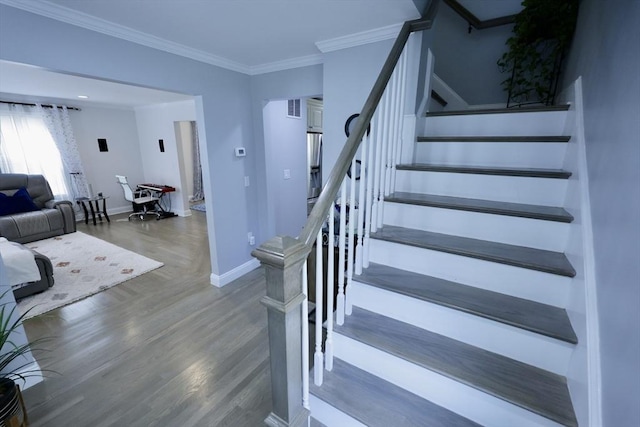 21 Florence Ave, Lowell, MA 01851 - stairs featuring wood finished floors, baseboards, and crown molding