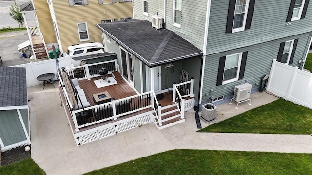 21 Florence Ave, Lowell, MA 01851 - back of property featuring a wooden deck, central AC unit, a patio area, ac unit, and roof with shingles