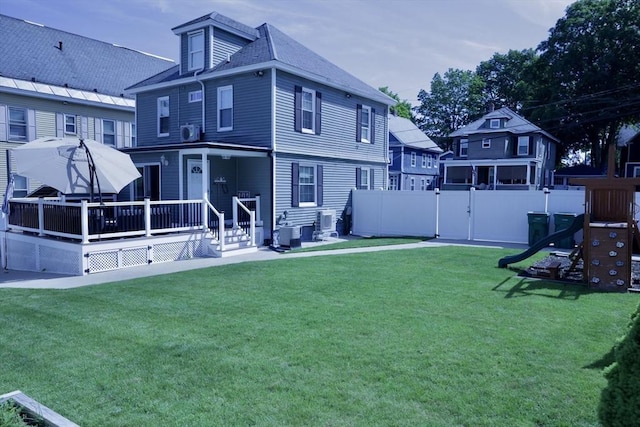 21 Florence Ave, Lowell, MA 01851 - back of house with a wooden deck and a gate