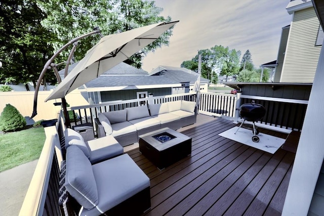 21 Florence Ave, Lowell, MA 01851 - wooden deck with an outdoor living space with a fire pit