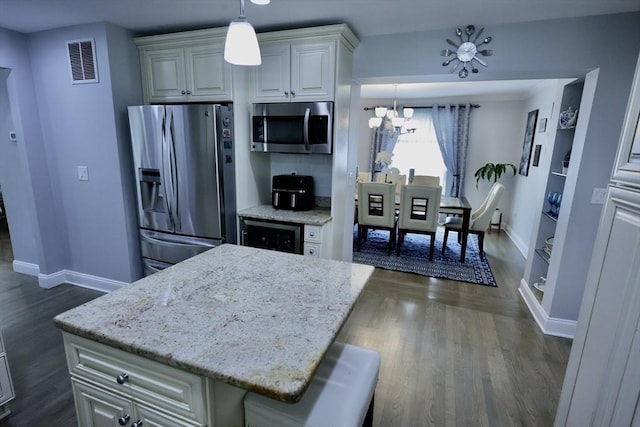 21 Florence Ave, Lowell, MA 01851 - kitchen featuring stainless steel appliances, beverage cooler, baseboards, a chandelier, and light stone counters
