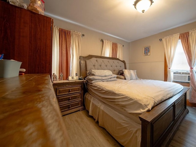 42 Morton St, Lawrence, MA 01841 - bedroom with cooling unit and wood finished floors