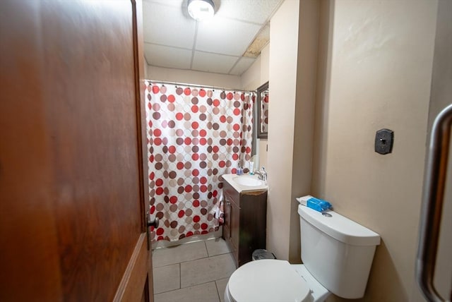 42 Morton St, Lawrence, MA 01841 - full bath with a drop ceiling, toilet, vanity, tile patterned flooring, and curtained shower