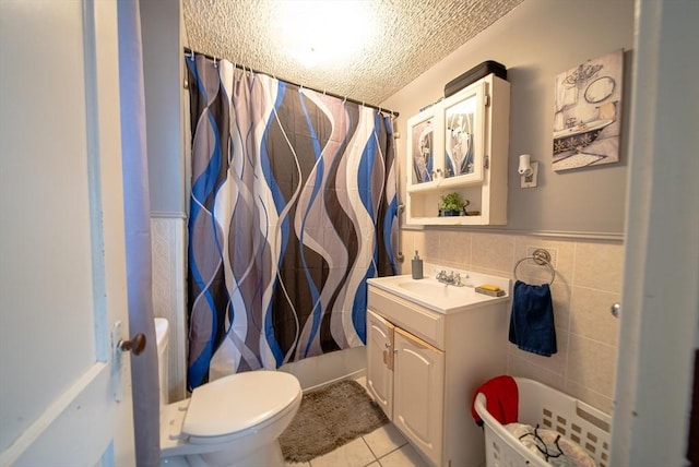 42 Morton St, Lawrence, MA 01841 - full bathroom featuring a textured ceiling, vanity, tile patterned flooring, a shower with shower curtain, and toilet
