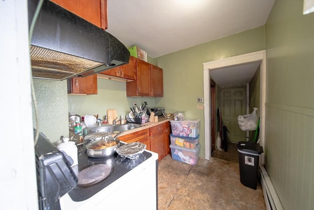 42 Morton St, Lawrence, MA 01841 - kitchen featuring range hood, a sink, baseboard heating, brown cabinets, and light countertops