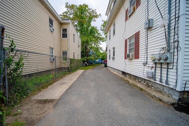 42 Morton St, Lawrence, MA 01841 - view of vehicle parking featuring asphalt driveway and cooling unit