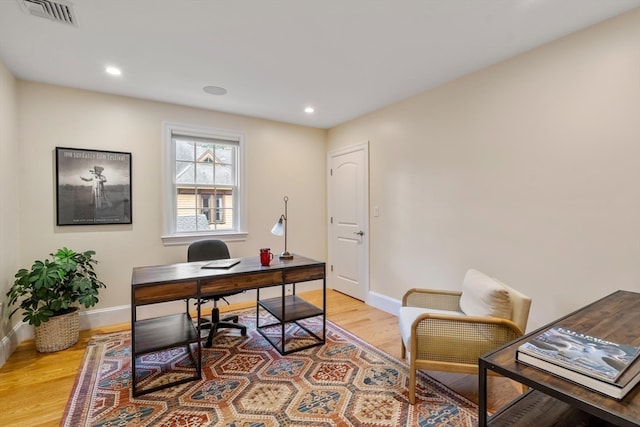 office space with light hardwood / wood-style floors