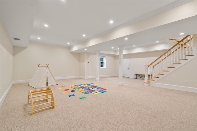 recreation room featuring crown molding and carpet flooring