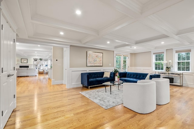 living room with light hardwood / wood-style flooring, beamed ceiling, coffered ceiling, and crown molding