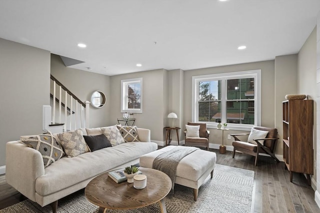 living room with baseboards, stairway, wood finished floors, and recessed lighting