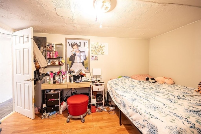 bedroom featuring hardwood / wood-style flooring