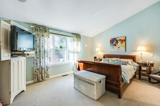 carpeted bedroom with vaulted ceiling