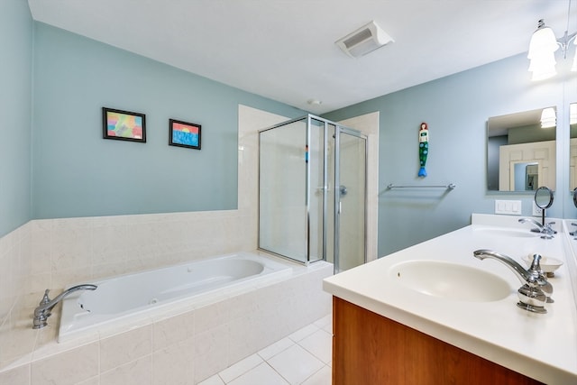 bathroom featuring shower with separate bathtub, vanity, and tile patterned floors