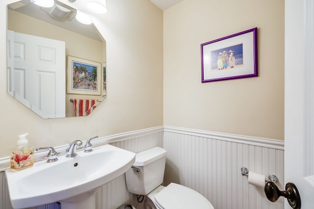 bathroom with sink and toilet