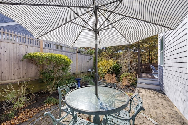 view of patio with a wooden deck