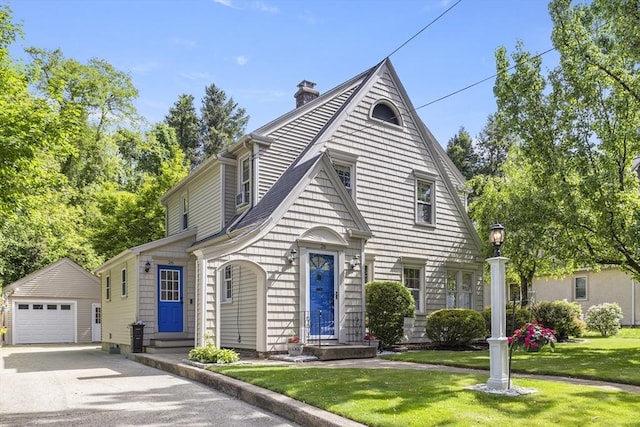 26 Edgewood Ave, Longmeadow, MA 01106 - view of front of house featuring an outdoor structure, driveway, a chimney, a front yard, and a garage