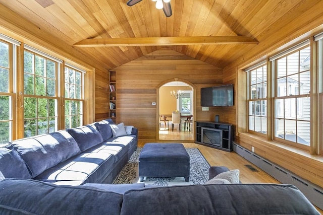 26 Edgewood Ave, Longmeadow, MA 01106 - living room featuring wood walls, wooden ceiling, a baseboard radiator, arched walkways, and light wood-style flooring