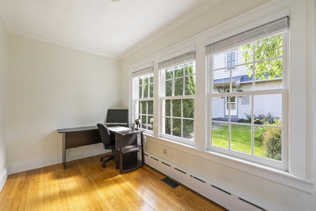 26 Edgewood Ave, Longmeadow, MA 01106 - office area featuring a baseboard heating unit, ornamental molding, light wood-style flooring, and baseboards