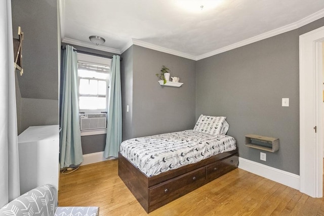 26 Edgewood Ave, Longmeadow, MA 01106 - bedroom featuring wood finished floors, baseboards, cooling unit, and crown molding
