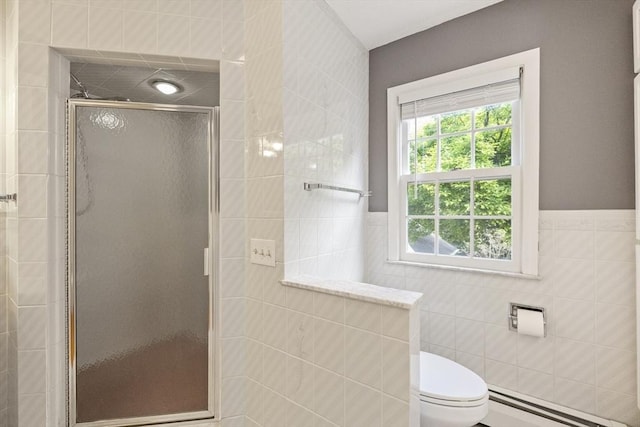 26 Edgewood Ave, Longmeadow, MA 01106 - full bathroom featuring a baseboard radiator, tile walls, a shower stall, toilet, and a wainscoted wall
