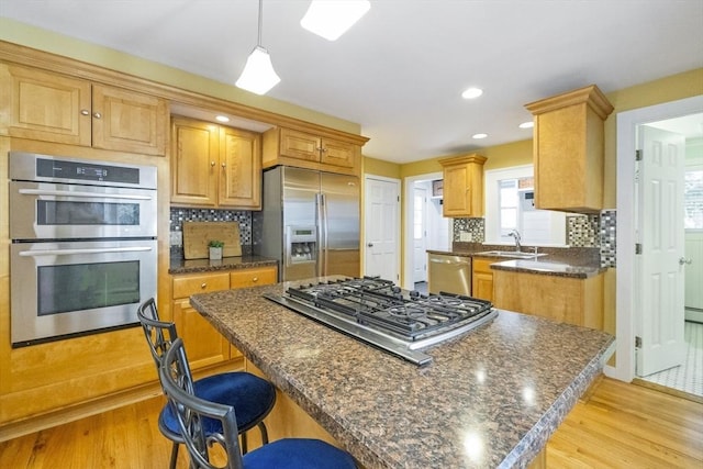 26 Edgewood Ave, Longmeadow, MA 01106 - kitchen with stainless steel appliances, a sink, a center island, light wood finished floors, and recessed lighting
