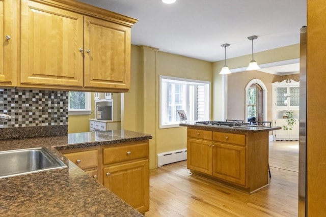 26 Edgewood Ave, Longmeadow, MA 01106 - kitchen with baseboard heating, healthy amount of natural light, light wood-style flooring, and decorative backsplash