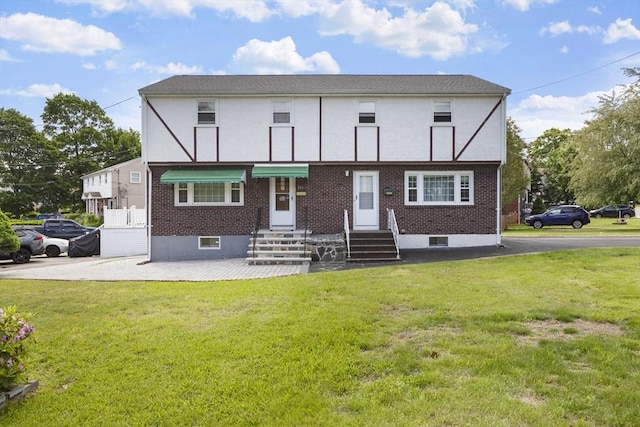 156 Old St Unit 156, Randolph, MA 02368 - view of front facade with entry steps, a front lawn, and brick siding