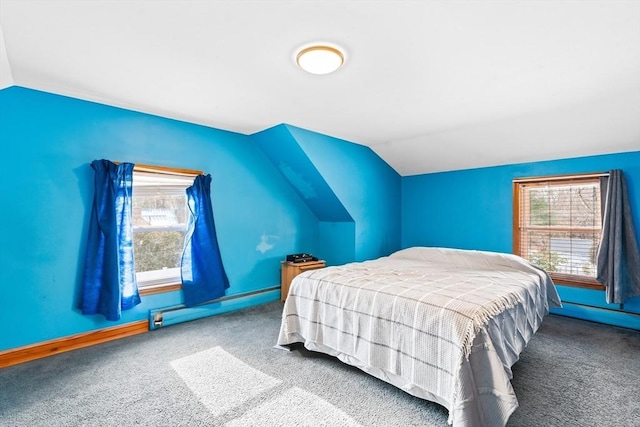 carpeted bedroom with vaulted ceiling and baseboard heating