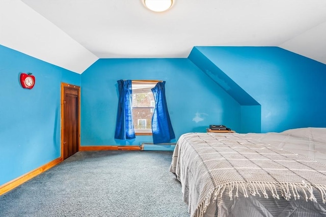 bedroom featuring vaulted ceiling, carpet flooring, and a baseboard radiator