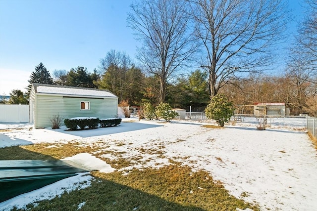 view of yard layered in snow