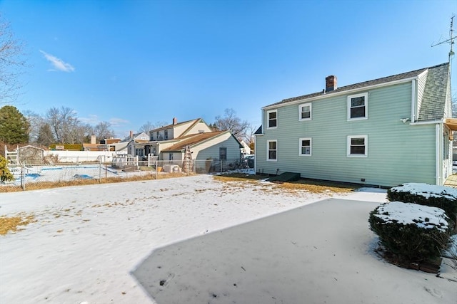 view of snow covered house