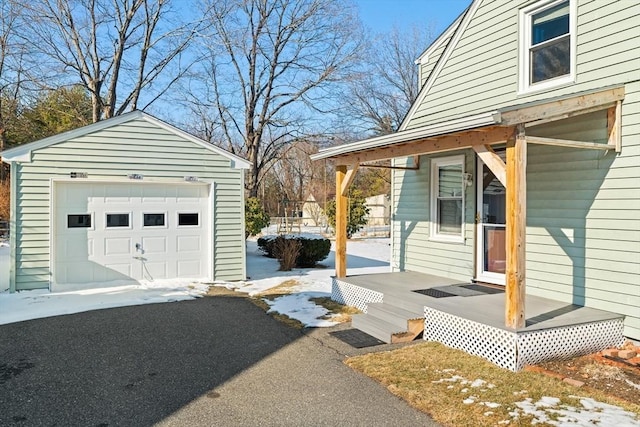 view of side of property with a garage and an outdoor structure